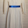 Set of white dresses with blue sashes